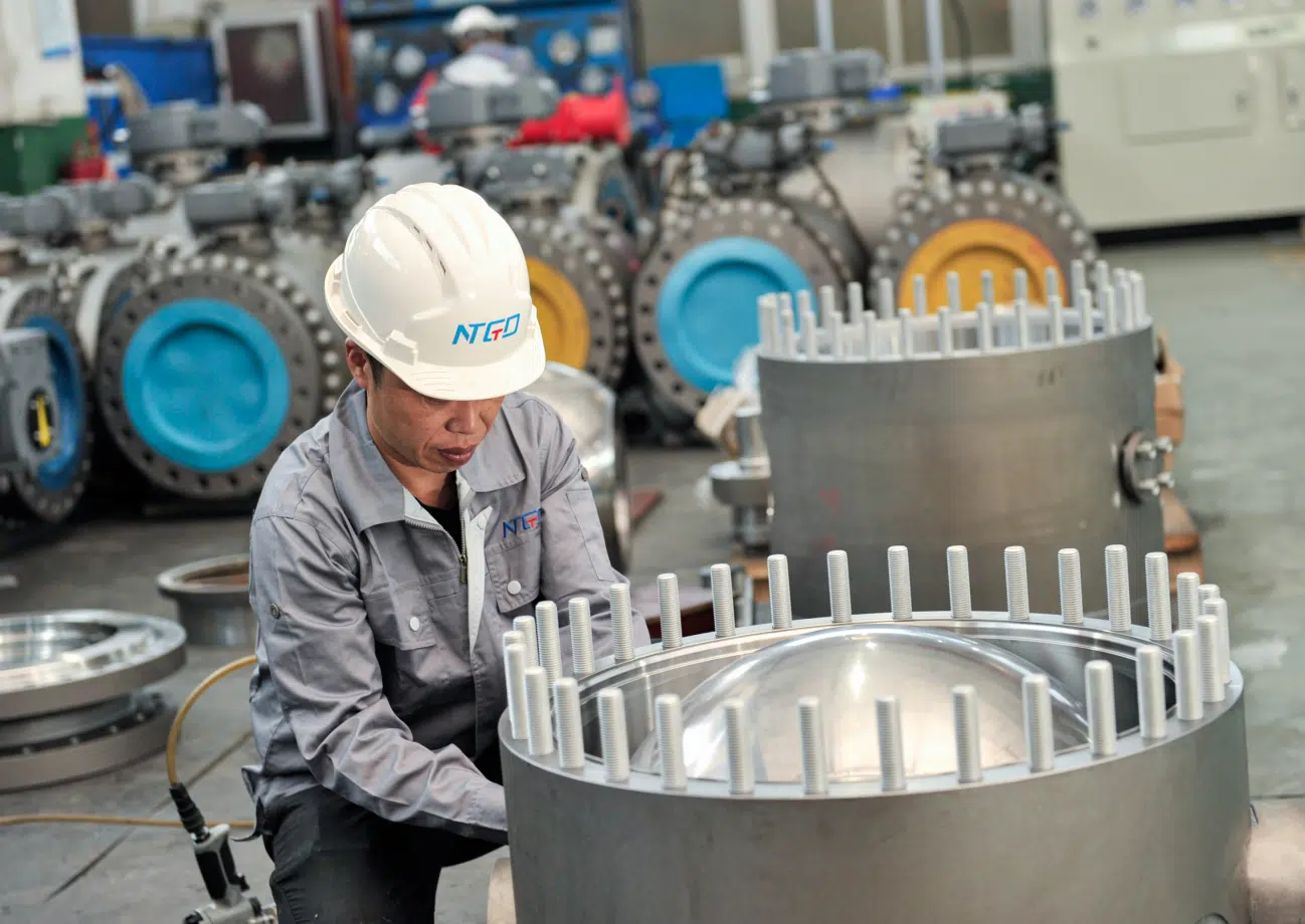 Large diameter industrial valve assembly workshop showing engineering complexity and flange connection details