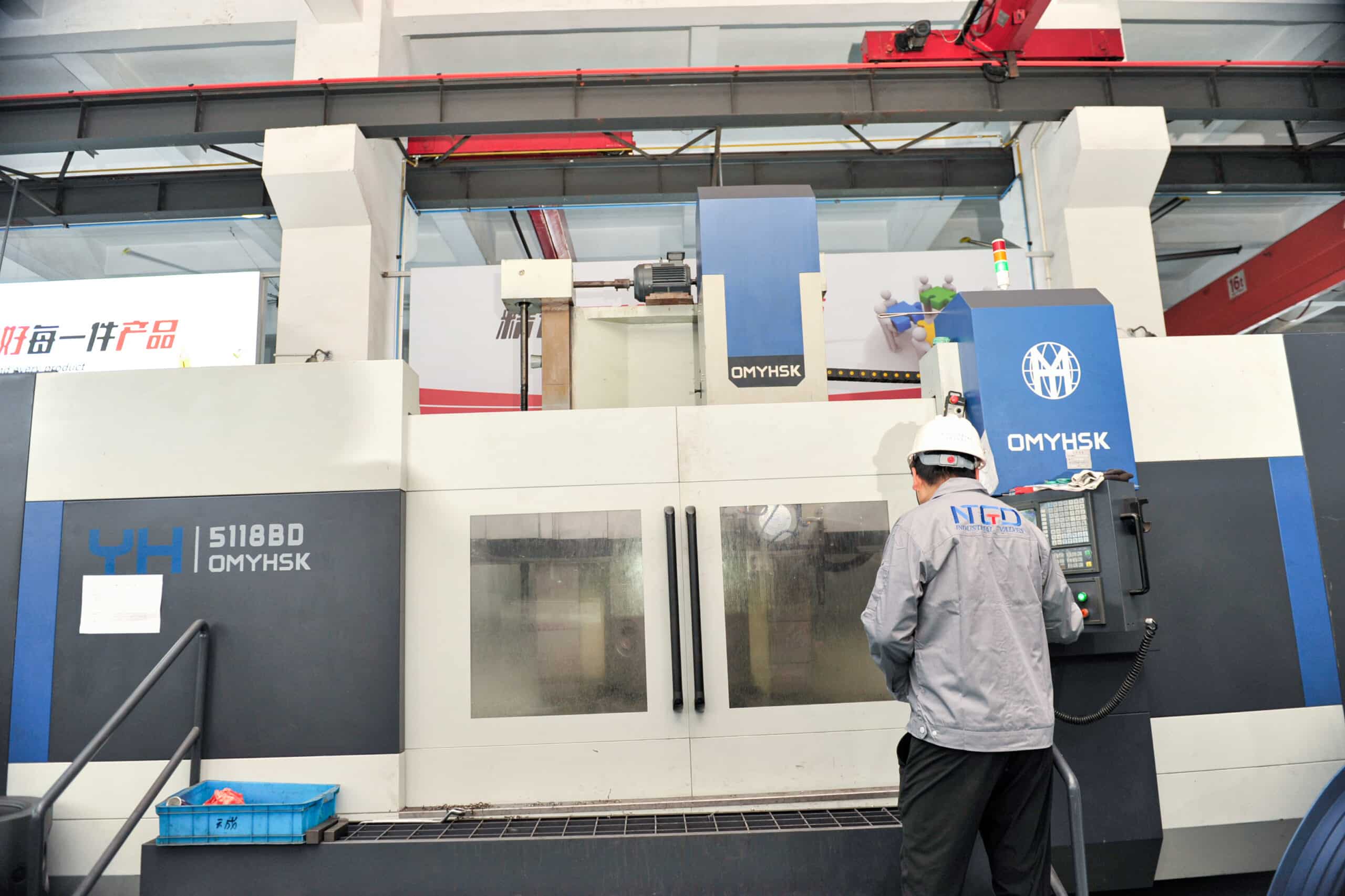 NTGD technician operating CNC machining center for industrial valve parts