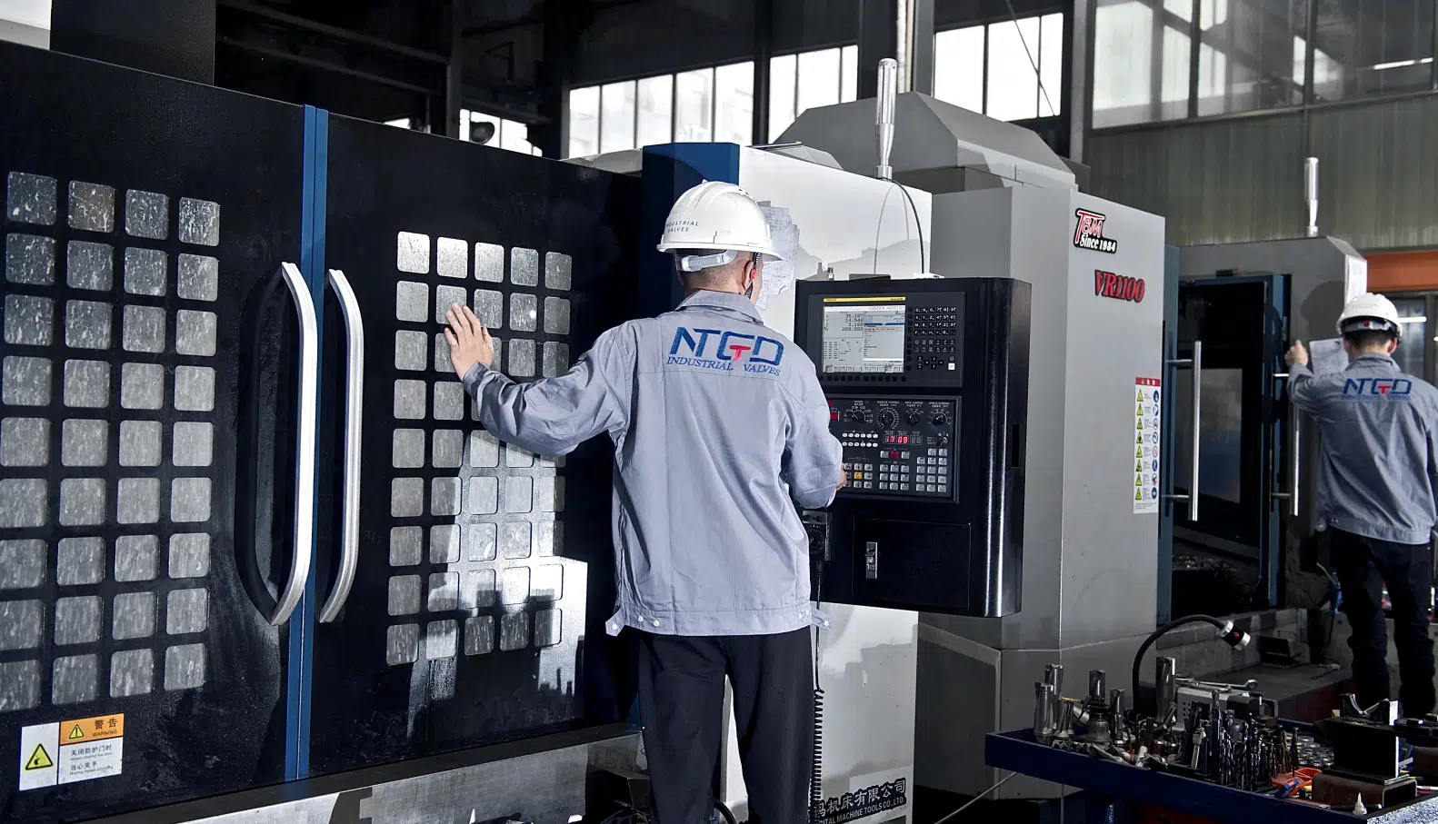Industrial valve CNC machining process in factory showing precision manufacturing capability for valve suppliers