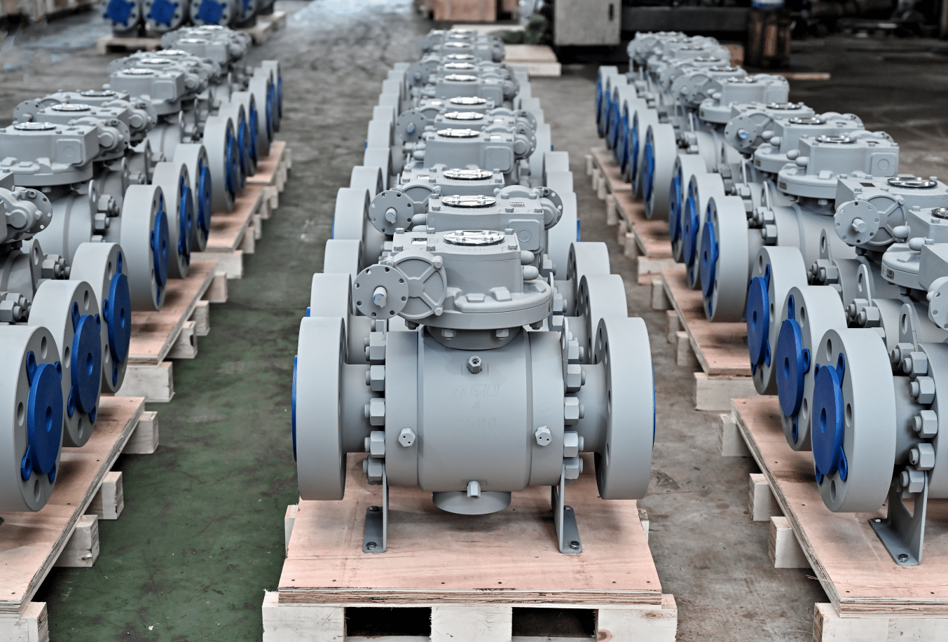 Trunnion mounted ball valves DN300 on factory production line showing manufacturing consistency and industrial valve assembly