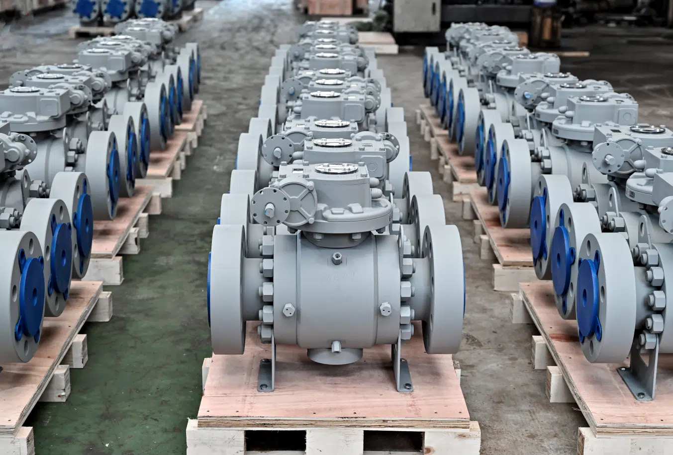 Trunnion mounted ball valves DN300 on factory production line showing manufacturing consistency and industrial valve assembly