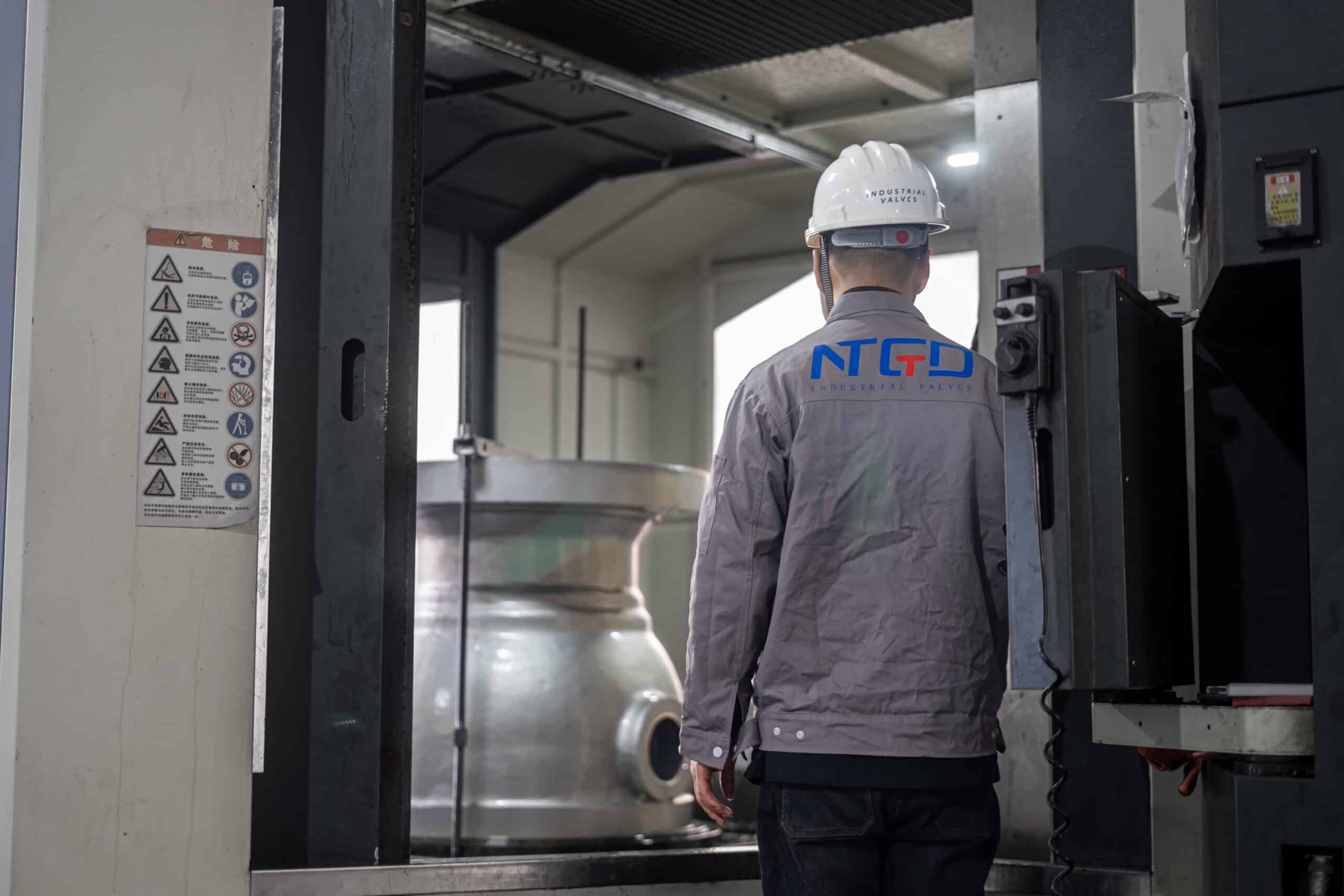 CNC machining center processing a large ball valve body in NTGD factory