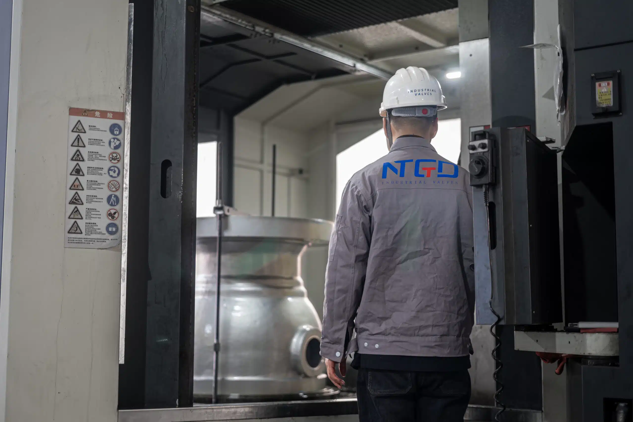 CNC machining center processing a large ball valve body in NTGD factory