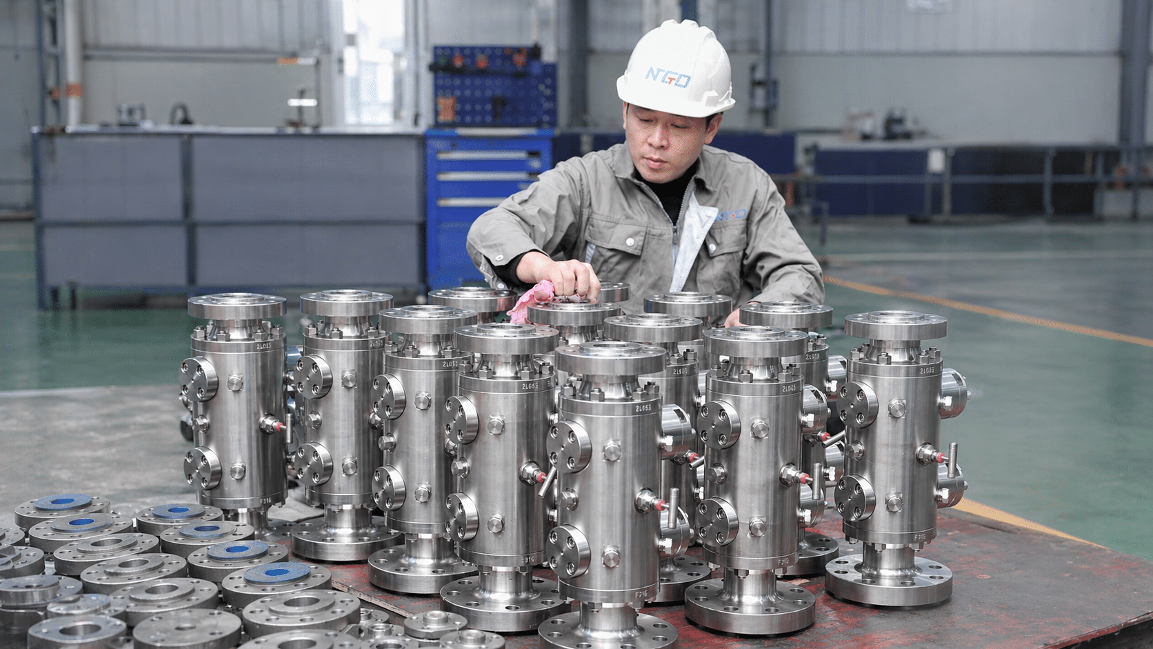 Factory inspection photo of stainless steel instrumentation DBB valve assemblies for sampling and chemical injection service