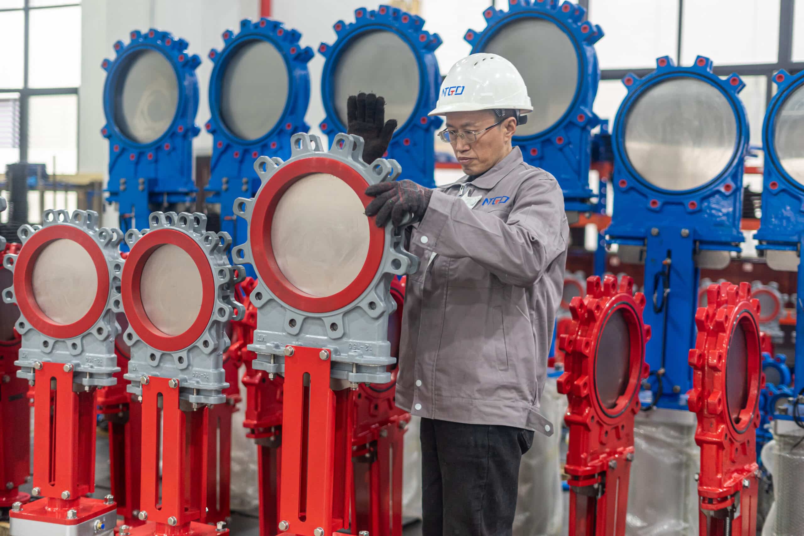 Knife gate valves inspected in workshop for slurry and solids-containing service