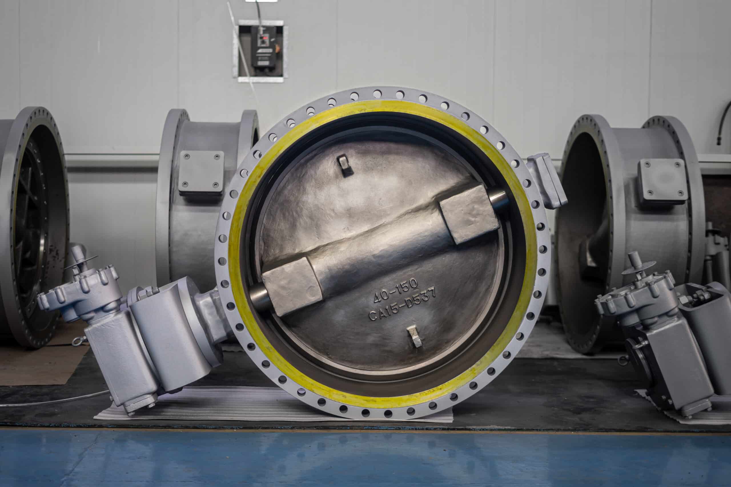 Large flanged butterfly valve in a factory workshop for industrial manufacturer evaluation