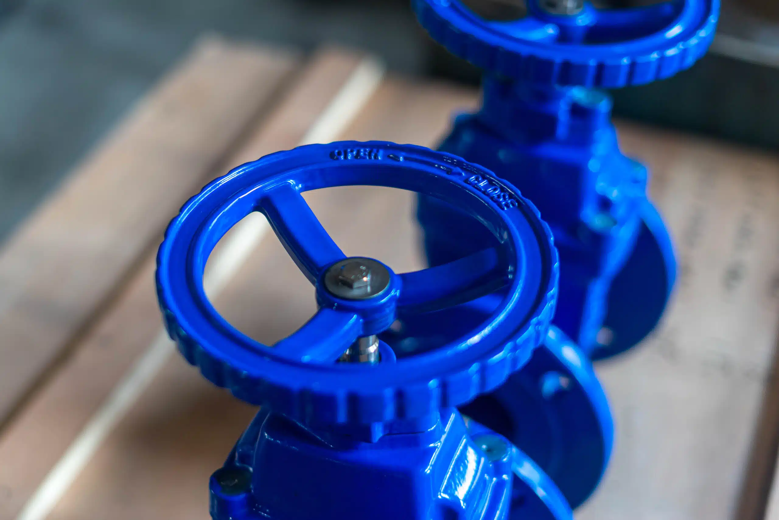 Close-up of ductile iron gate valve handwheel and blue coated valve body