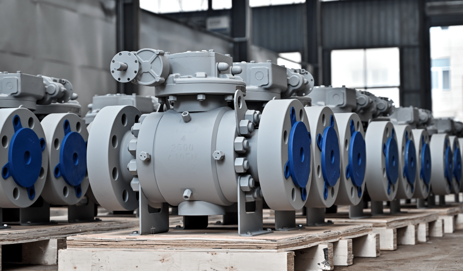 Industrial flanged ball valves arranged in NTGD factory workshop