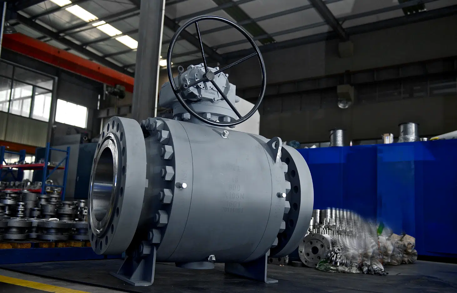 Real industrial trunnion ball valve in a workshop for ball valve specification review.